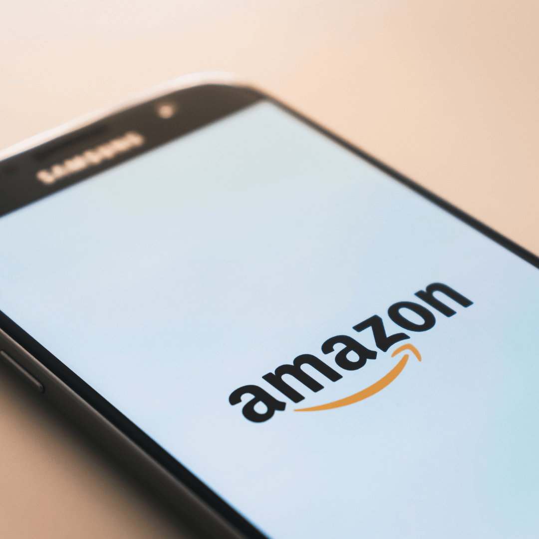 Amazon logo on phone screen, Amazon Prime is an example of a business with a subscription model
